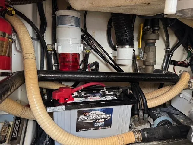 Slide: The Image of Engine compartment of a 2009 Formula 400ss with MarineMaster AGM battery and various components. - 17