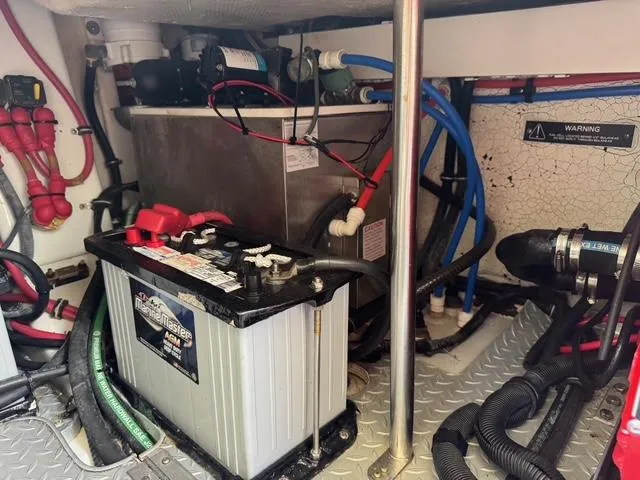 Slide: The Image of Engine compartment of a 2009 Formula 400ss with battery and wiring components. - 19