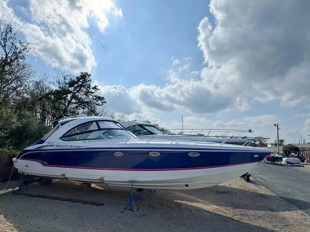 Slide: The Image of 2009 Formula 400ss boat on land under a partly cloudy sky. - 2