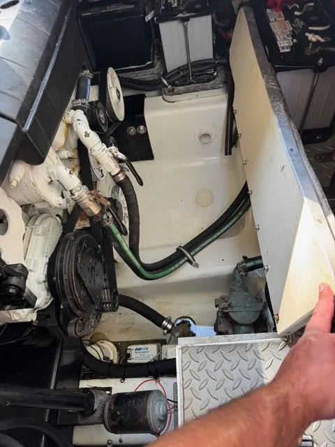Slide: The Image of Engine compartment of a 2009 Formula 400ss boat, showing mechanical components and wiring. - 21