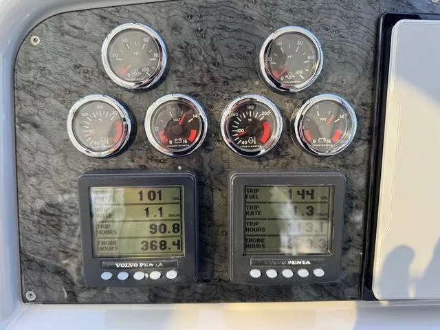 Slide: The Image of Dashboard of a 2009 Formula 400ss boat with gauges and digital displays. - 22