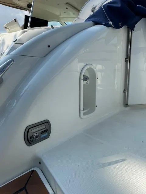 Slide: The Image of 2009 Formula 400ss boat interior, featuring sleek white design and control panel. - 25