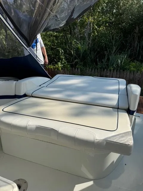 Slide: The Image of 2009 Formula 400ss boat with cushioned seating, outdoor setting, and canopy. - 26