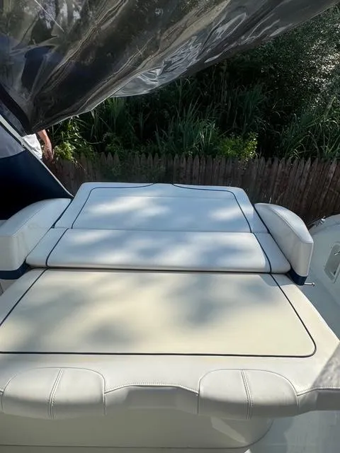 Slide: The Image of 2009 Formula 400ss boat with white cushioned seating, outdoor setting. - 27