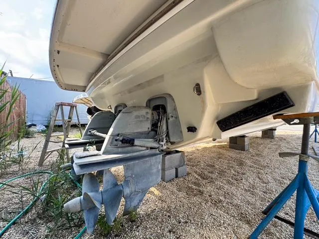 Slide: The Image of 2009 Formula 400ss boat underside with propeller and outdrive, on stands for maintenance. - 29