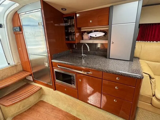 Slide: The Image of Luxurious 2009 Formula 400ss yacht interior with modern kitchen and sleek cabinetry. - 31