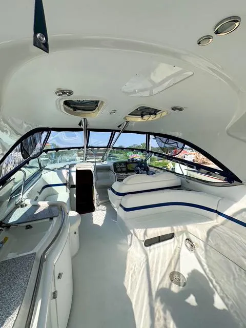 Slide: The Image of Interior of a 2009 Formula 400ss yacht, featuring sleek white seating and modern design. - 33