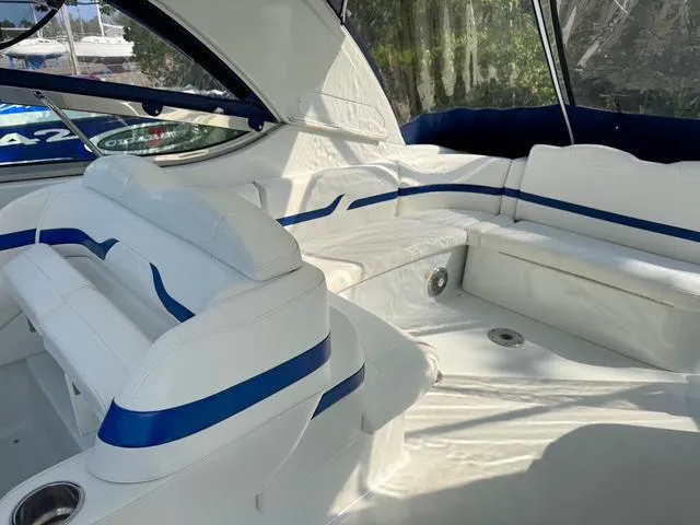Slide: The Image of Interior of a 2009 Formula 400ss boat with white and blue seating. - 36