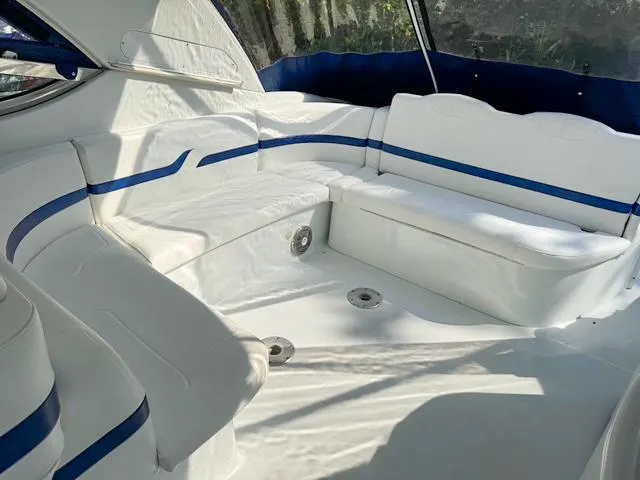 Slide: The Image of 2009 Formula 400ss boat interior with white and blue seating, spacious and well-lit. - 37