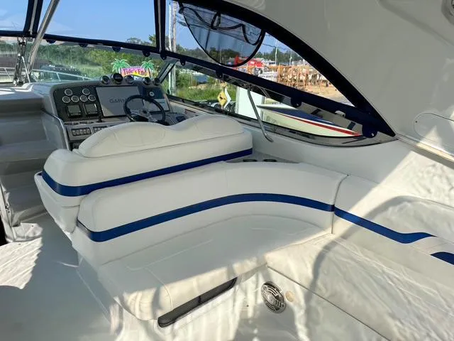 Slide: The Image of Interior of a 2009 Formula 400ss boat with white and blue seating. - 38