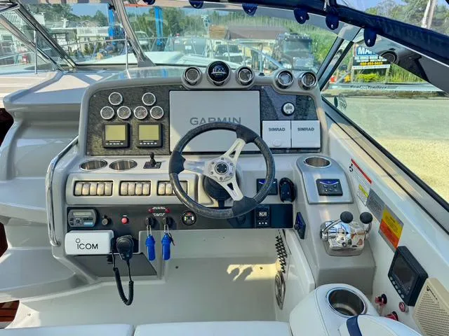 Slide: The Image of Control panel of a 2009 Formula 400ss boat with Garmin and Simrad navigation systems. - 42