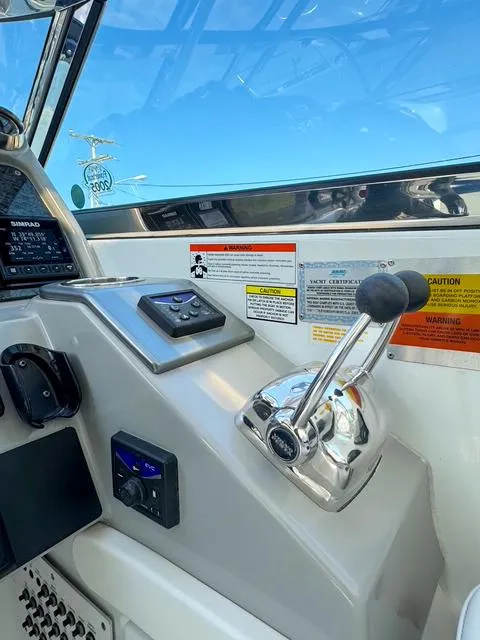 Slide: The Image of Control panel of a 2009 Formula 400ss boat with throttle lever and navigation instruments. - 43
