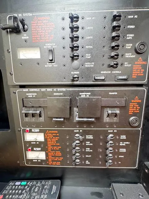 Slide: The Image of Control panel of a 2009 Formula 400ss boat with various switches and warnings. - 45