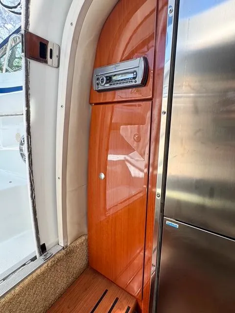 Slide: The Image of Interior of 2009 Formula 400ss boat with wood paneling and stereo system. - 46