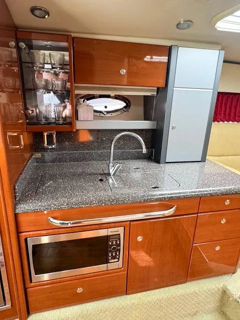 Slide: The Image of Luxurious 2009 Formula 400ss yacht kitchen with modern appliances and sleek cabinetry. - 49
