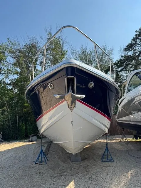 Slide: The Image of 2009 Formula 400ss boat on stands, front view, outdoors, clear sky. - 6
