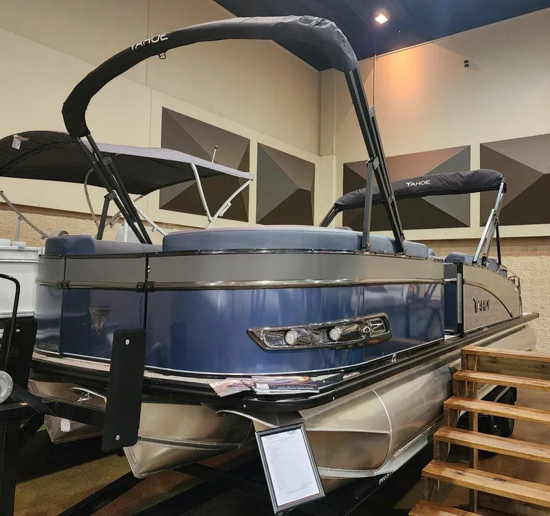 The Image of 2025 Tahoe Pontoon Cascade Cruise Rear Bench on display indoors. - 0