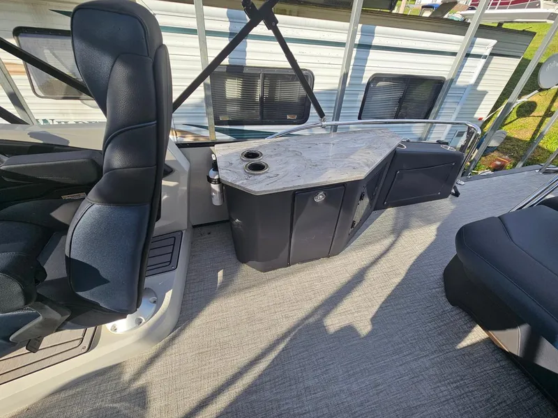 Slide: The Image of 2025 Tahoe Pontoon Cascade Cruise Rear Bench interior with seating and storage. - 7