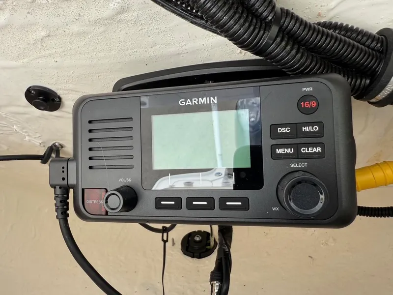 Slide: The Image of Garmin marine radio installed on 2023 Sea Hunt BX22 boat dashboard. - 19