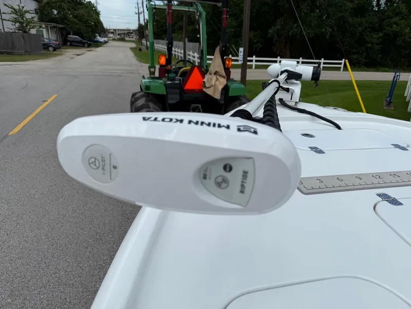 Slide: The Image of 2023 Sea Hunt BX22 boat with Minn Kota trolling motor on a street. - 20