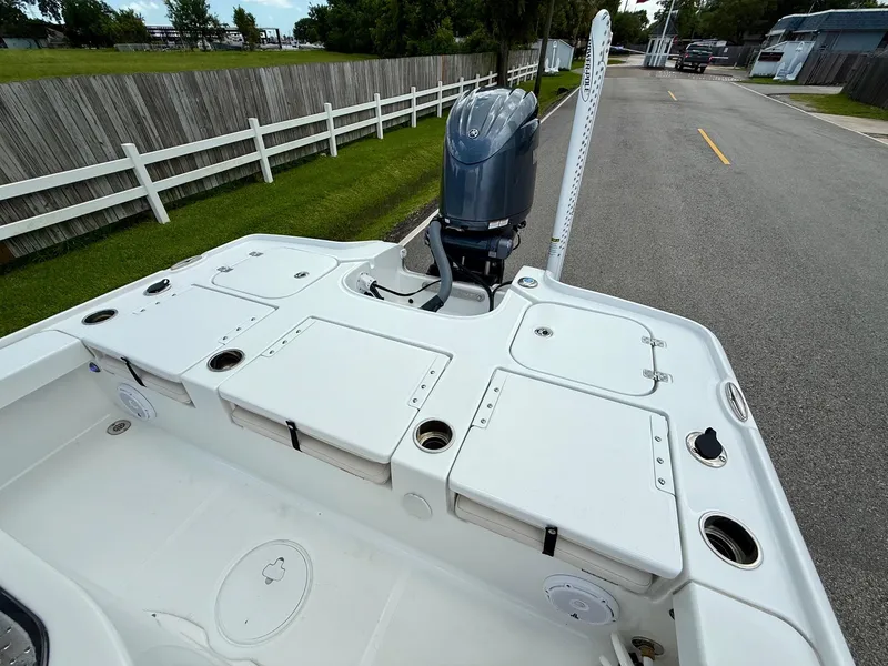 Slide: The Image of 2023 Sea Hunt BX22 boat with outboard motor on a trailer. - 8