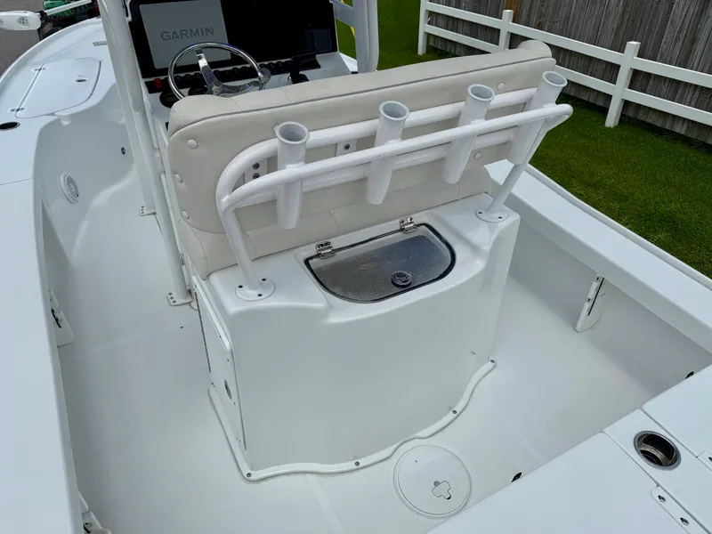 Slide: The Image of 2023 Sea Hunt BX22 boat interior with rod holders and Garmin navigation system. - 9