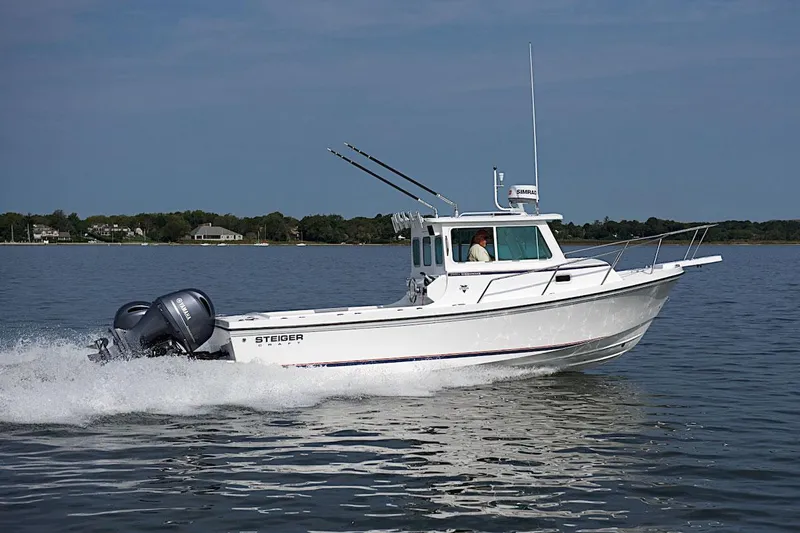 Slide: The Image of 2026 Steiger Craft 255 Miami boat cruising on calm water. - 4