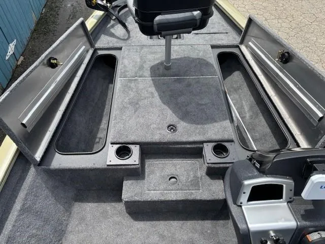 Slide: The Image of 2025 Tracker Pro Team 175 boat interior with open storage compartments and seating. - 10