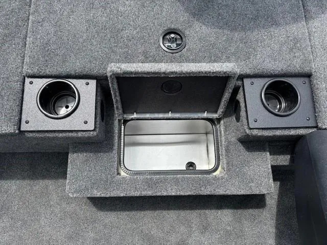 Slide: The Image of 2025 Tracker Pro Team 175 boat interior with storage compartment and cup holders. - 12