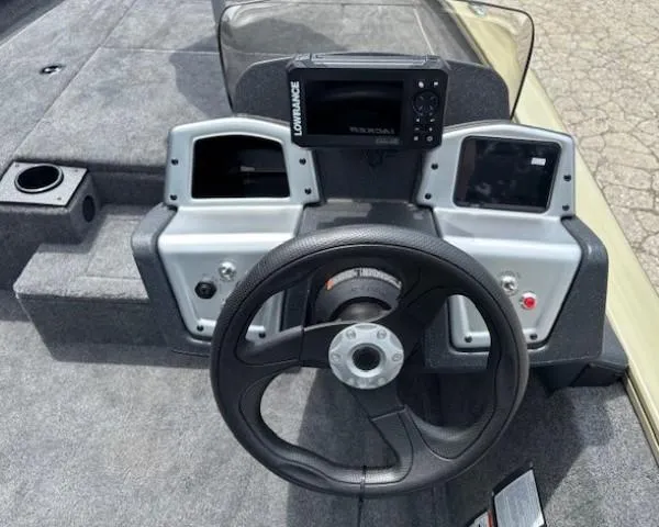Slide: The Image of Steering console of 2025 Tracker Pro Team 175 boat with navigation system. - 15
