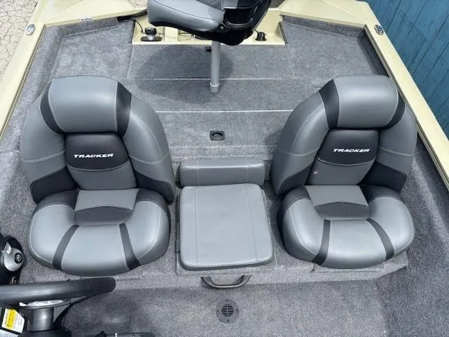 Slide: The Image of 2025 Tracker Pro Team 175 boat interior with two gray seats and a center console. - 16