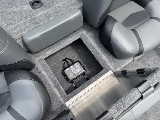 Slide: The Image of 2025 Tracker Pro Team 175 boat interior with storage compartment and seating. - 17