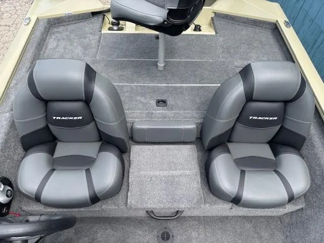 Slide: The Image of 2025 Tracker Pro Team 175 boat interior with gray cushioned seats. - 18