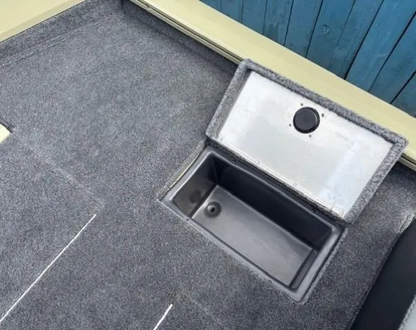 Slide: The Image of 2025 Tracker Pro Team 175 boat interior with open storage compartment. - 21