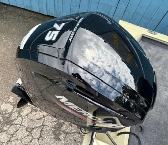 Slide: The Image of 2025 Tracker Pro Team 175 boat with Mercury 75 engine, reflecting sky and clouds. - 22