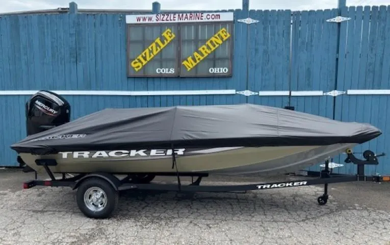 Slide: The Image of 2025 Tracker Pro Team 175 boat with cover on trailer, parked at Sizzle Marine, Ohio. - 23