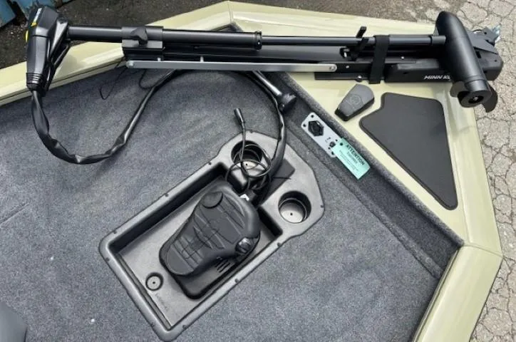 Slide: The Image of 2025 Tracker Pro Team 175 boat deck with trolling motor and foot pedal controls. - 7