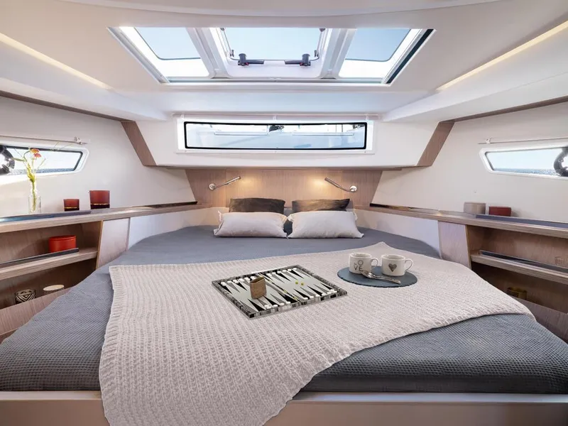 Slide: The Image of Luxurious interior of 2024 Sealine C335V yacht with cozy bed and skylight. - 15
