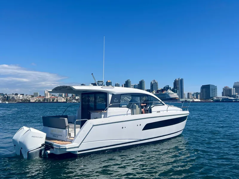 Slide: The Image of 2024 Sealine C335V yacht on water with city skyline in background. - 5