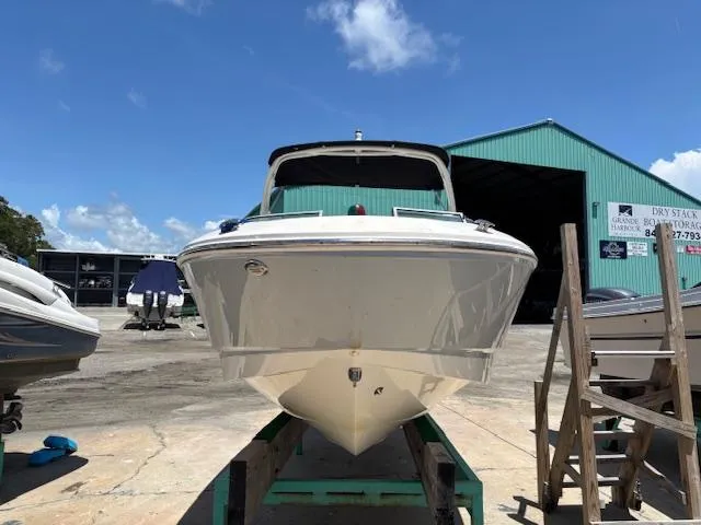 Slide: The Image of Chaparral 210 Deluxe 2019 boat on dry dock under clear blue sky. - 3