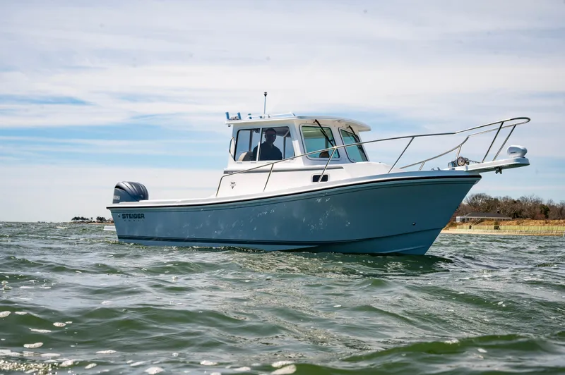 Slide: The Image of 2026 Steiger Craft 23 Miami boat cruising on open water. - 10