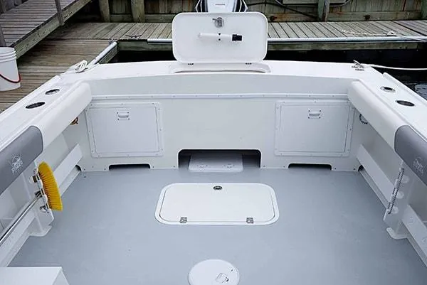 Slide: The Image of 2026 Steiger Craft 23 Miami boat interior with storage compartments and clean deck design. - 17