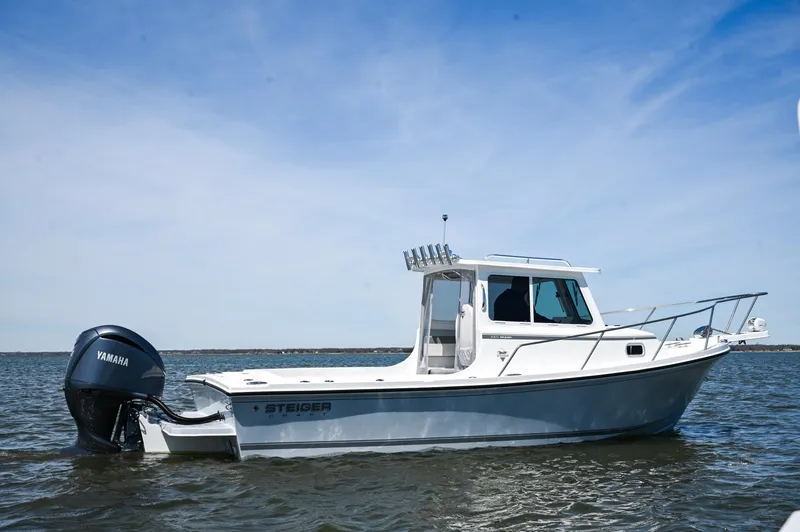 Slide: The Image of 2026 Steiger Craft 23 Miami boat on water with Yamaha outboard motor. - 8