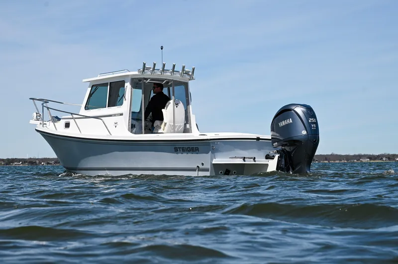 Slide: The Image of 2026 Steiger Craft 23 Miami boat on water with Yamaha outboard motor. - 9