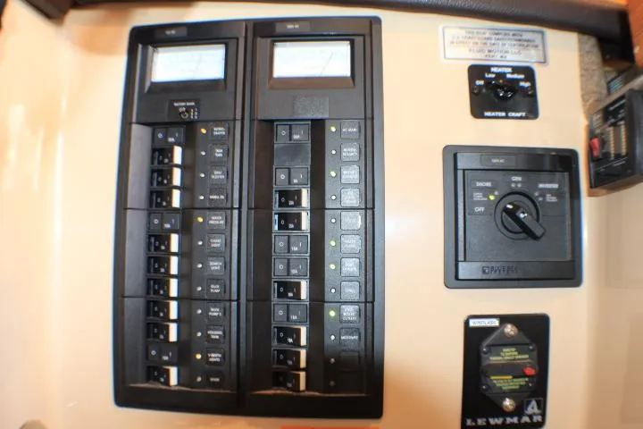 Slide: The Image of Electrical panel of a 2014 Ranger Tugs R-27 boat with switches and meters. - 29