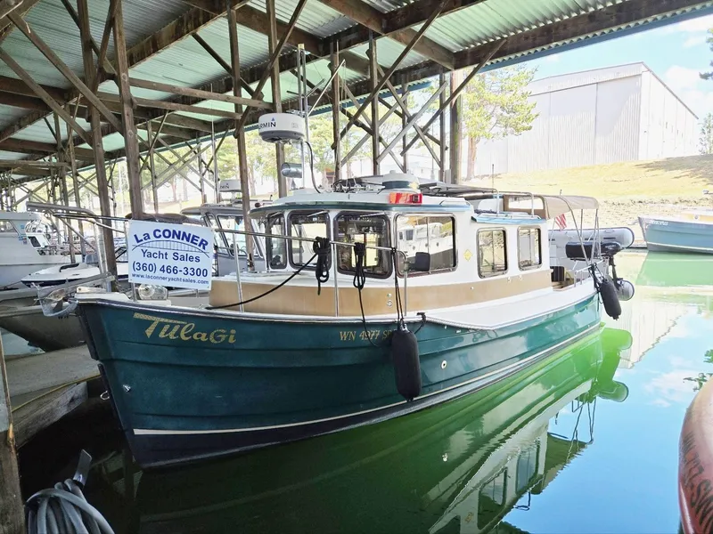 Slide: The Image of 2014 Ranger Tugs R-27 boat docked at La Conner Yacht Sales. - 4