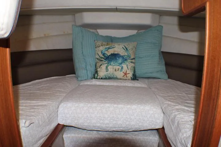 Slide: The Image of Cozy cabin interior of 2014 Ranger Tugs R-27 with nautical-themed pillows. - 43