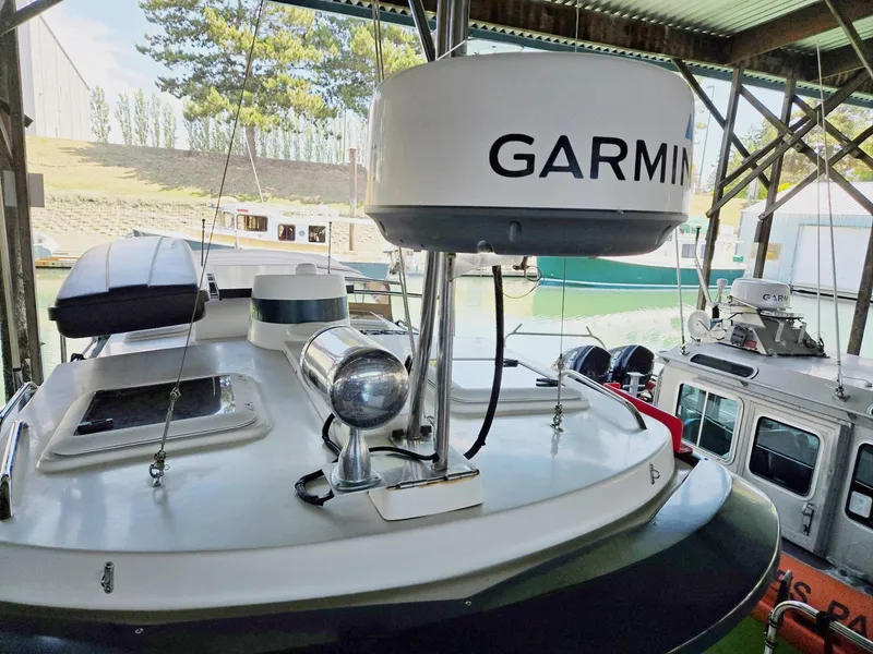 Slide: The Image of 2014 Ranger Tugs R-27 boat with Garmin radar in a marina setting. - 7