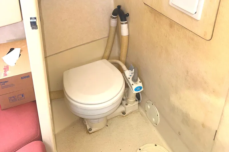 Slide: The Image of Interior of 2000 Rosborough 246LVS boat with striped seating and table. - 22