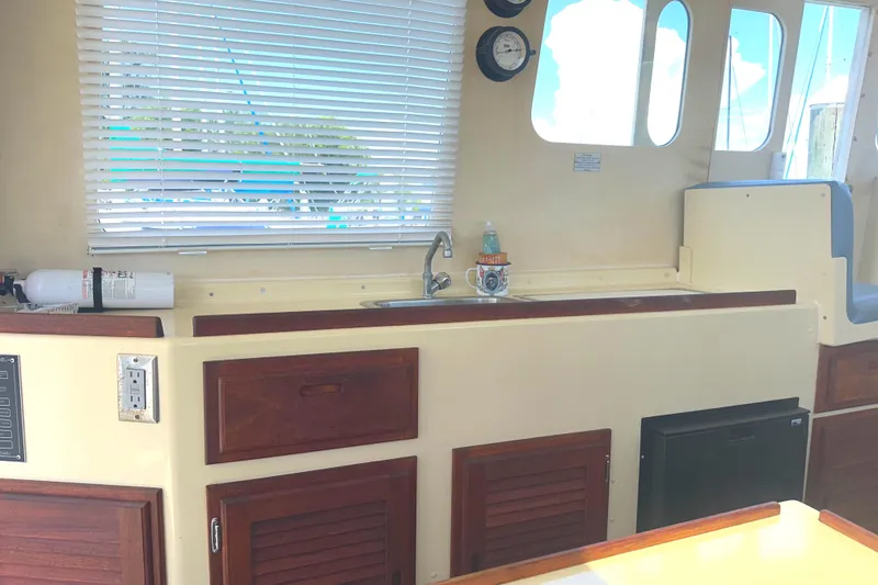 Slide: The Image of Helm of 2000 Rosborough 246LVS boat with Garmin navigation system and steering wheel. - 28